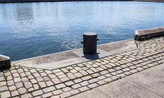 Different bollards and technical installations of vessel traffic at the Kiel port photo