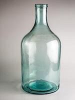 Empty old glass jar with a narrow neck for wine and spirits. Made in the USSR around 1930s photo