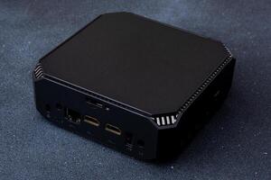 A small system unit of a personal computer. Compact device. photo