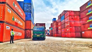 Jakarta, Indonesia on December 6, 2023. Stacks of colorful containers at a logistics warehouse in Cakung. photo