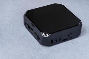 A small system unit of a personal computer. Compact device. photo