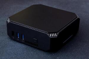A small system unit of a personal computer. Compact device. photo