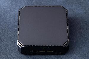 A small system unit of a personal computer. Compact device. photo