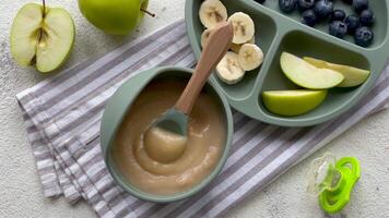 Healthy baby food in bowl. video