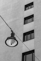 a modern building with a lamp photo