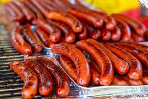 roasted fresh beef sausages on a grill photo