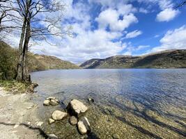 A view of Loch Lomond in Scotland on a sunny day photo