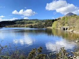 A view of Loch Lomond in Scotland on a sunny day photo