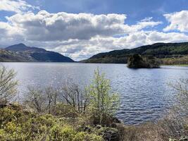 A view of Loch Lomond in Scotland on a sunny day photo