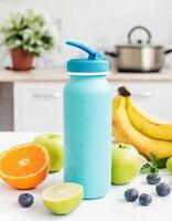 Sport drink bottle mockup with fruits on table, kitchen background photo