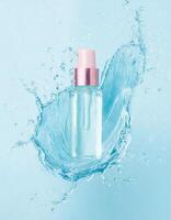 Glass cosmetic bottle with abstract water splash blue background for banner photo