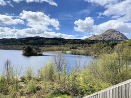 A view of Loch Lomond in Scotland on a sunny day photo