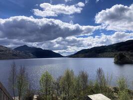 A view of Loch Lomond in Scotland on a sunny day photo