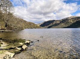 A view of Loch Lomond in Scotland on a sunny day photo