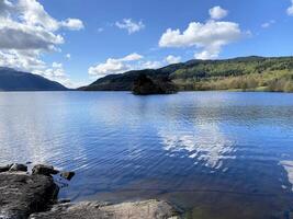 A view of Loch Lomond in Scotland on a sunny day photo