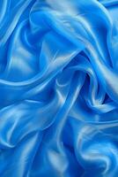 Tranquil blue silk waves flowing fabric abstract background with serene space for text placement photo