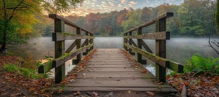 Tranquil morning mist over wooden bridge on serene lake with tranquil surroundings of lush trees photo