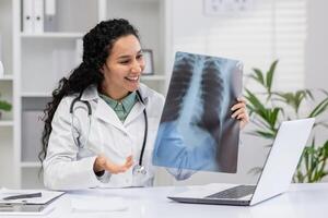 A cheerful female radiologist analyzes a chest X-ray in her medical office, discussing findings and diagnostics with a patient virtually. photo