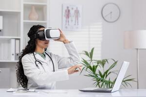 A female doctor in white coat uses a virtual reality headset in a well-lit modern clinic office, demonstrating the integration of advanced technology in medical training and patient care. photo