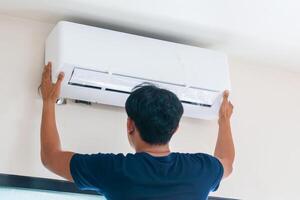 Technicians install new air conditioners, Repairman service for repair and maintenance of air conditioners photo