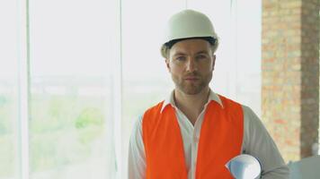 Engineer developer in helmet inspecting building. Builder constructor specialist. Civil engineer architect construction site video