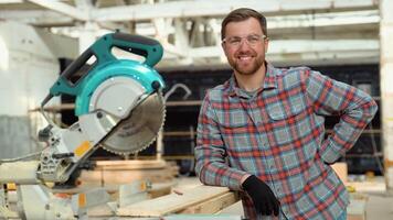 Builder saws a board with a circular saw in the cutting a wooden plank. Modular prefabricated houses concept video