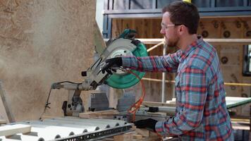 Builder saws a board with a circular saw in the cutting a wooden plank video