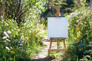 blank rustic wooden easel holding a canvas in a path garden photo