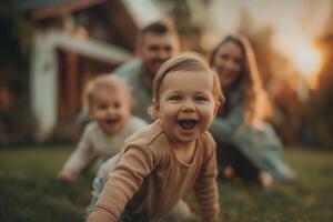 The couple is playing with their child in the backyard photo