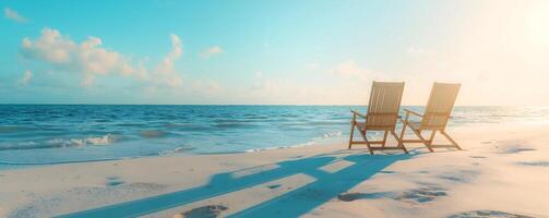 Two comfortable lounge chairs facing the calm sea photo