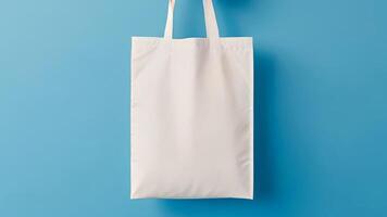 mockup white shopping bag on blue background. copy space, empty photo