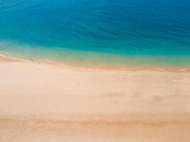 The ocean from a bird's eye view. Tropical sandy beach, clear water photo