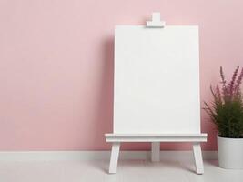 mockup easel with blank sheet on pink wall background with flower. copy space photo