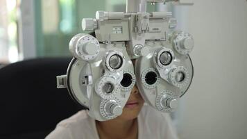 Child eye test in optical store, kid eye exam video