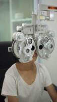 Child eye test in optical store, kid eye exam video