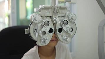 Child eye test in optical store, kid eye exam video