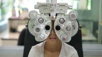 Child eye test in optical store, kid eye exam video