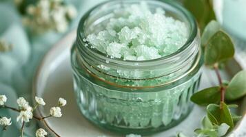 A vintage glass jar holds an exfoliating sugar scrub infused with invigorating peppermint and eucalyptus oils photo