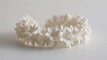 Delicate floralinspired bracelet made from a flexible 3D printed material evoking a blooming garden photo