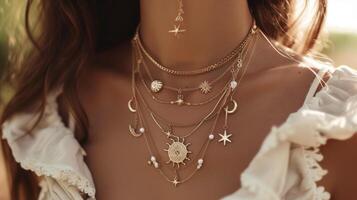 Channeling your inner goddess with a tiered necklace set featuring celestial charms on each chain photo