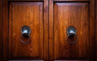 Mysterious old door entrance. Dark light. Abstract concept of secret, horror and magic photo