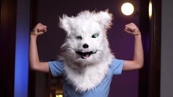 boy in dog mask for halloween shows hand gestures video