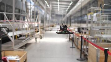FPV drone flies inside a hangar, production facility, warehouse video