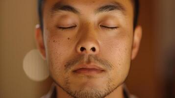 His eyes are closed as he takes a deep breath mentally preparing for the mindful tasting experience photo