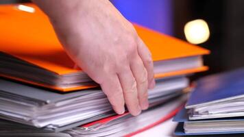 stack of colored folders with documents on the table video