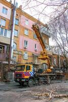 Dnepr, Ukraine - 03.20.2024 Mobile crane in the courtyard of an old apartment building photo