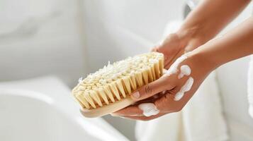 A person using a sauna brush to gently exfoliate their entire body reaching difficult spots with ease. photo