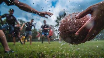 The sound of a football hitting a pair of hands echoes through the air as a group plays a friendly game of touch football photo