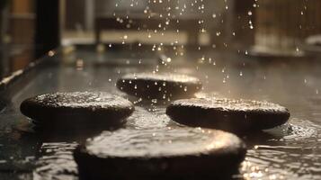 The heat slowly rising as the stones are sprinkled with water creating a steamy and relaxing atmosphere. photo