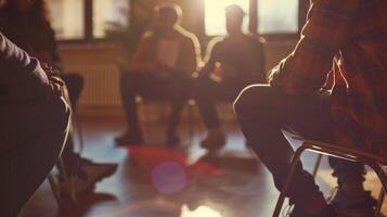 A group of strangers sitting in a circle at a support group meeting sharing their experiences and supporting each other on their journey of sobriety photo